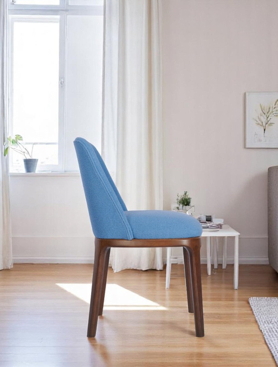 Elegant side chair in blue fabric with ergonomic back and medium oak finish"