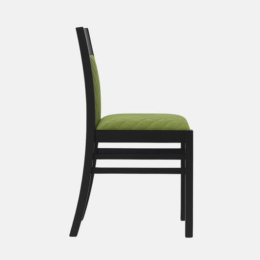Contemporary dining chair with black wooden frame and green quilted upholstered seat and backrest on a white background