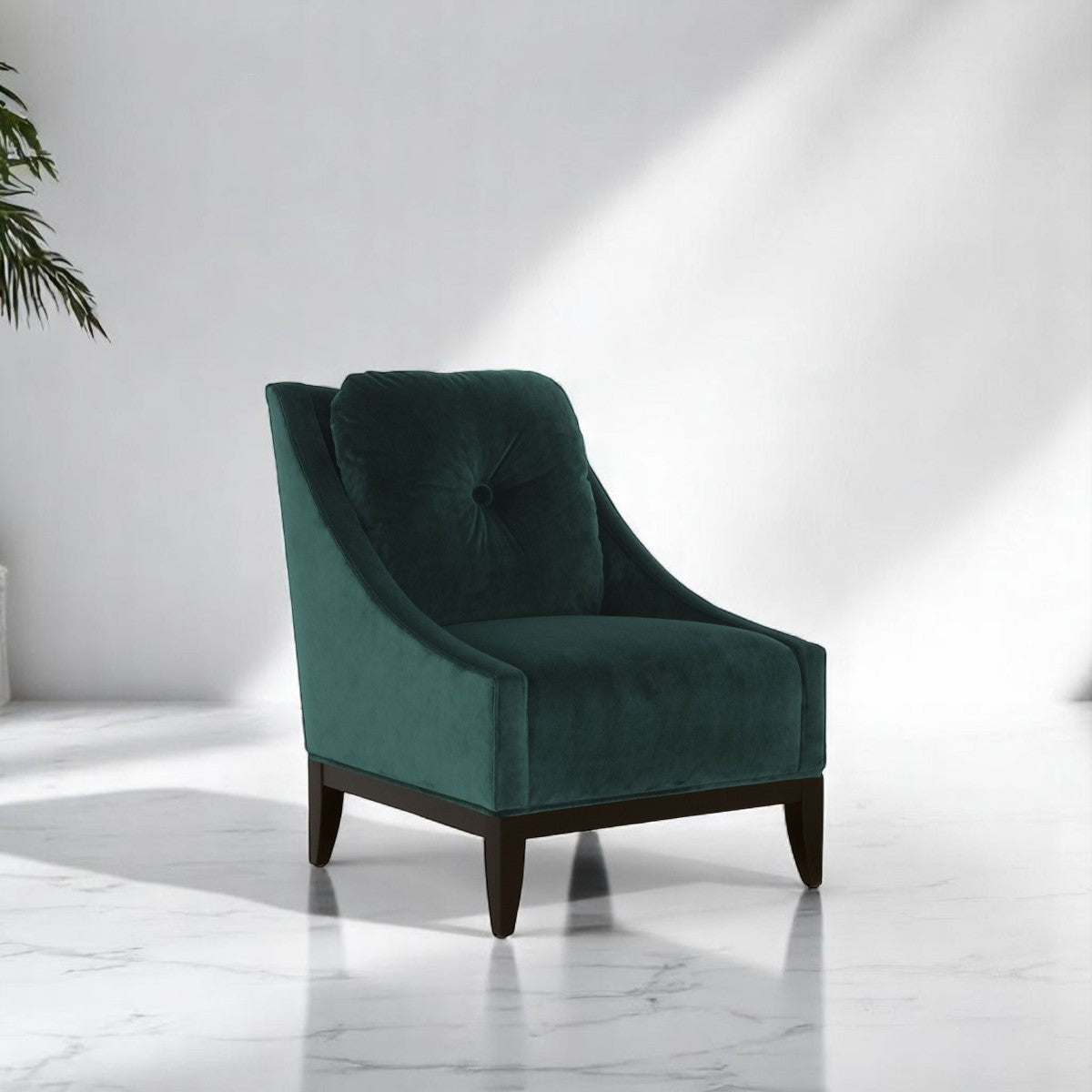 alt="Velvety green armchair with clean lines, soft square seat cushion, and black wooden legs"