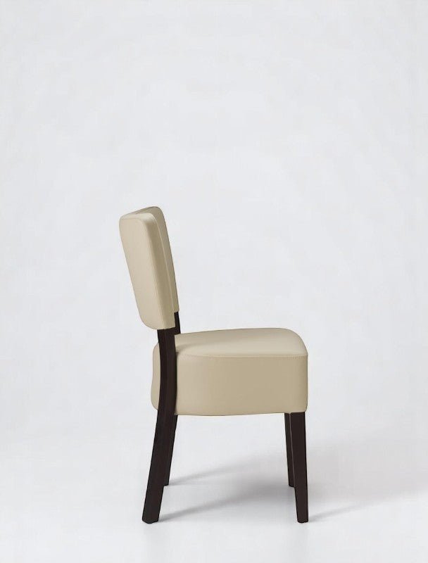 alt="Classic cream side chair in soft leather with contrasting black legs for a timeless look"