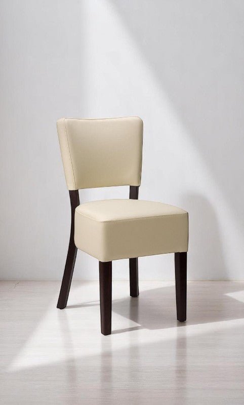 alt="Minimalist dining chair in black wood with a curved backrest"