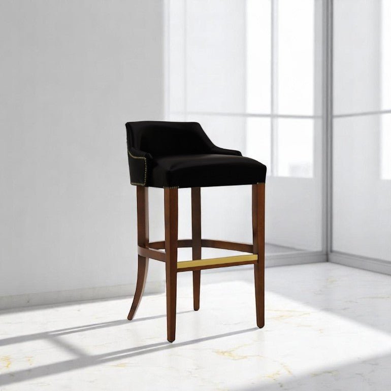 alt="Sleek black bar stool with leather seat and medium oak color legs for a modern look"