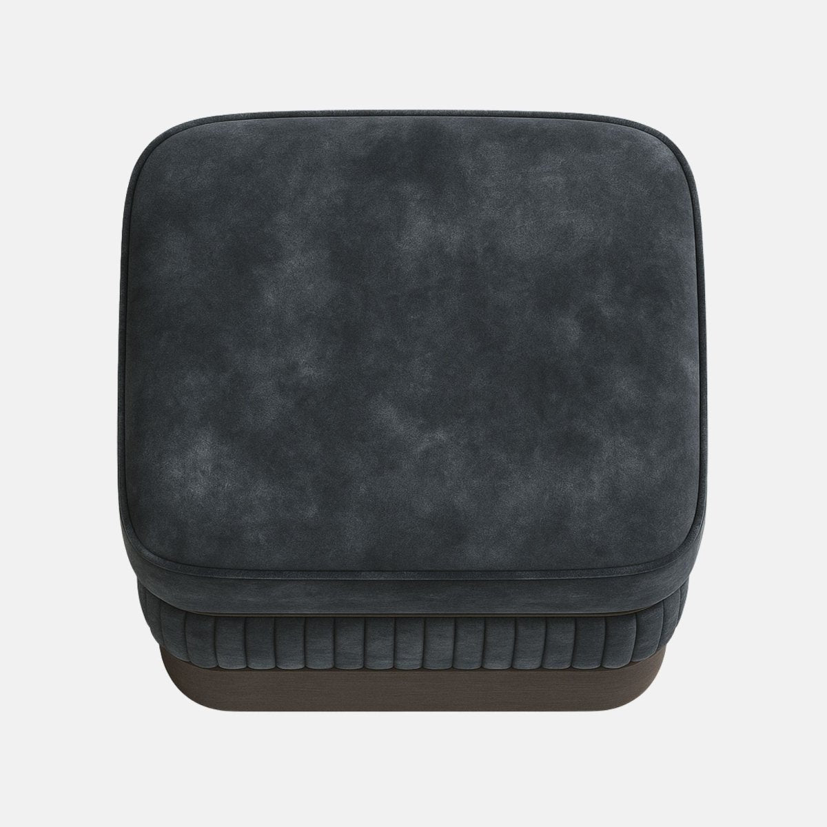 Dark grey upholstered ottoman with ribbed lower panel and smooth cushioned top on wooden base modern square footstool for living room or hotel lounge.