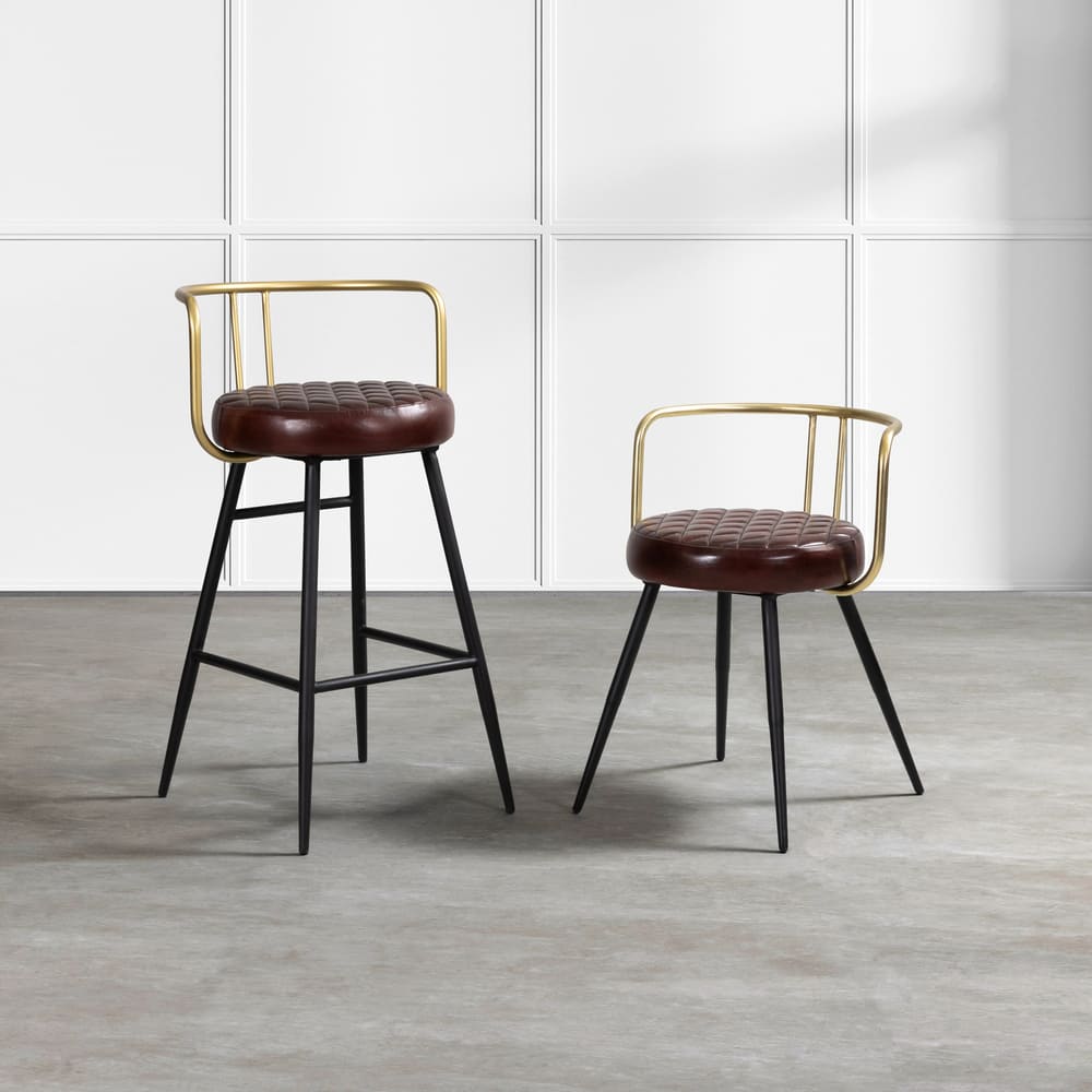 alt="Sleek high stool with rich leather seat, diamond stitch design, gold backrest bar, and black powder-coated legs"