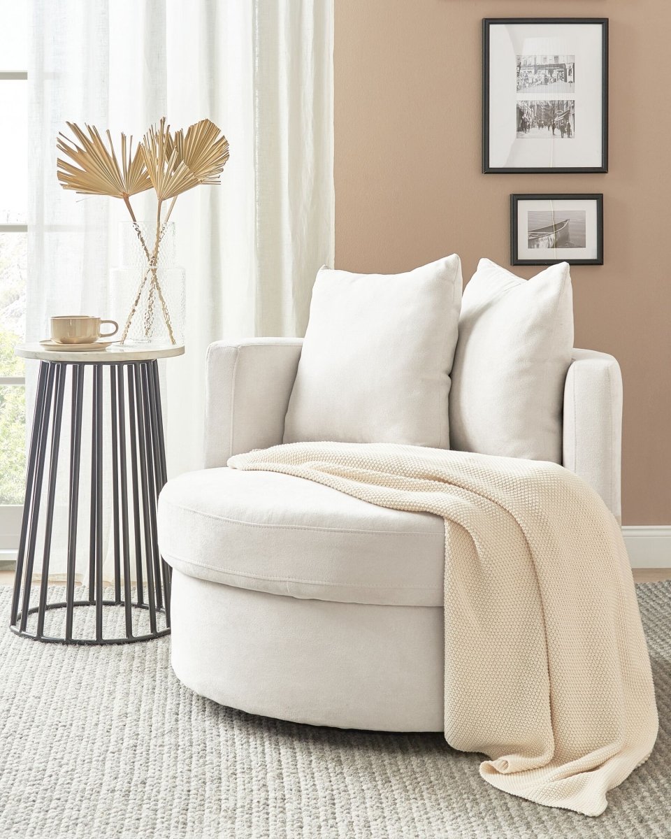 alt="Chic oval lounge chair with soft upholstery and functional swivel base for versatile seating"