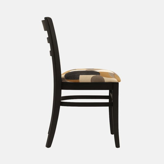 A black wooden dining chair with a slatted backrest and straight legs. The seat is upholstered in a modern geometric fabric in neutral tones of black, beige, gray, and brown. Photographed against a light background with realistic shadows, the design balances classic structure with contemporary upholstery.