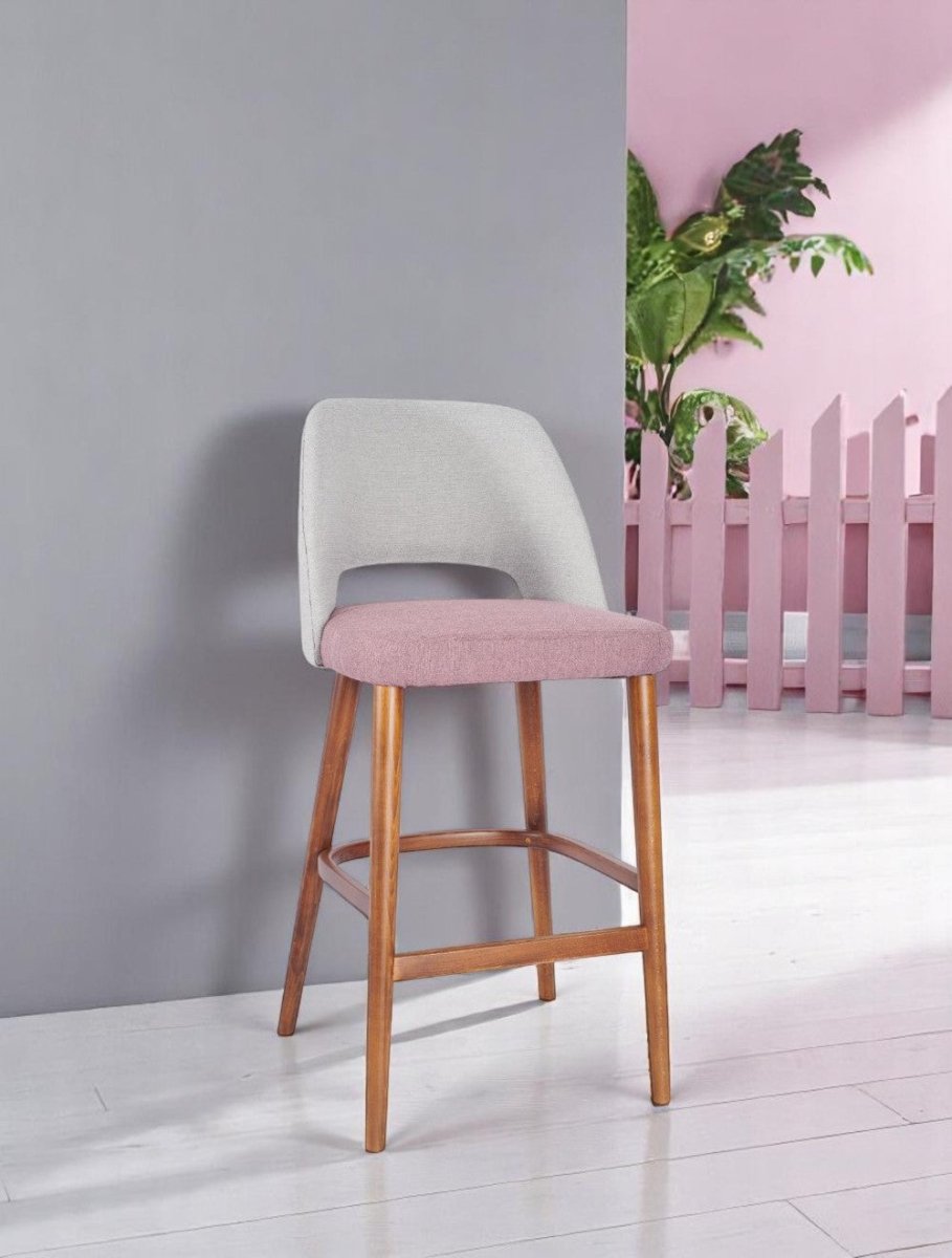 alt="Padded kitchen stool with ergonomic curved backrest and medium oak legs for added comfort"