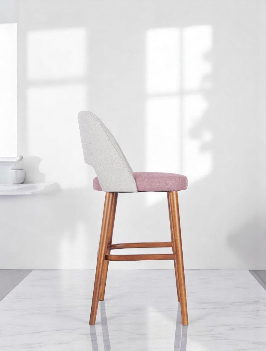 alt="Elegant padded seat kitchen stool featuring a curved backrest and medium oak finish legs"