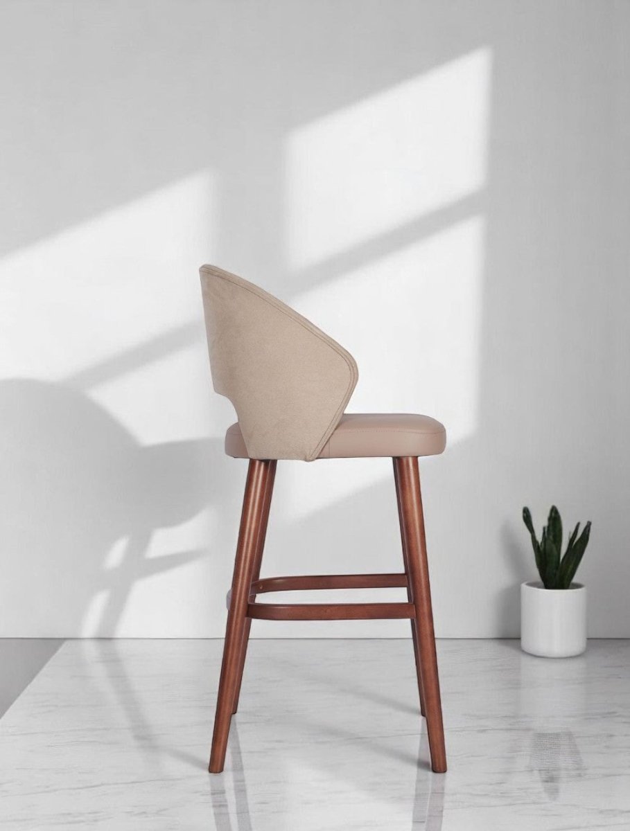 alt="Luxurious creme linen fabric kitchen stool with soft cushioning and medium oak finish legs"