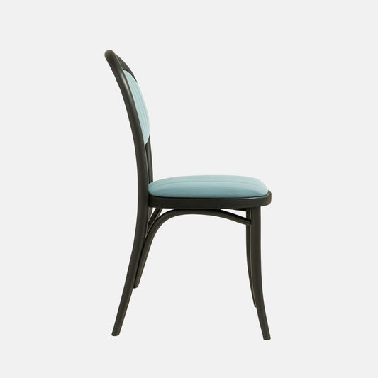 A modern chair with a black bentwood frame, rounded backrest, and upholstered seat and back cushion in light blue fabric with vertical stitching.
