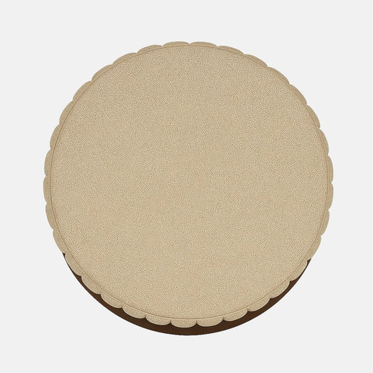 Beige upholstered round ottoman with ribbed detailing and dark wood band modern fabric footstool or accent stool for living room, bedroom, or hotel lounge.