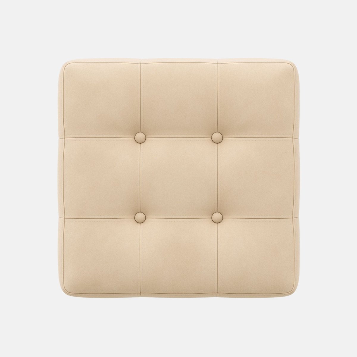 Square beige ottoman with tufted upholstery and button detailing on all sides