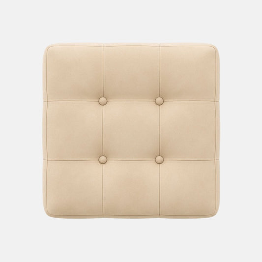 Square beige ottoman with tufted upholstery and button detailing on all sides