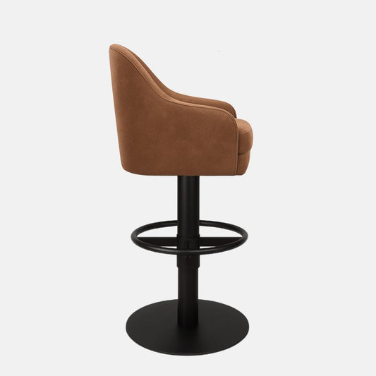 Brown upholstered bar stool with curved backrest, cushioned seat, and black pedestal base with circular footrest.