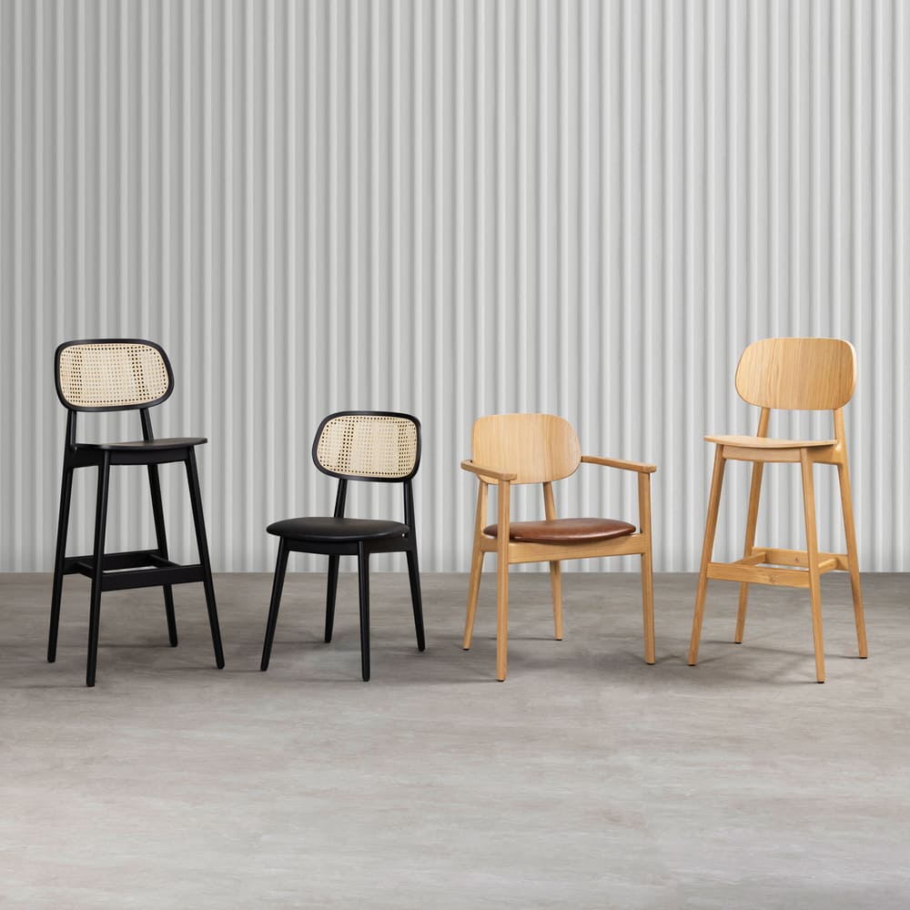 alt="Set of Italian-style dining chairs and bar stools in matching design with natural oak frames and upholstered seats"