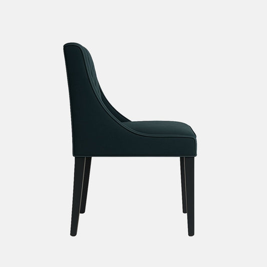 Elegant upholstered dining chair with deep green quilted backrest, curved arm detail, and black wooden legs