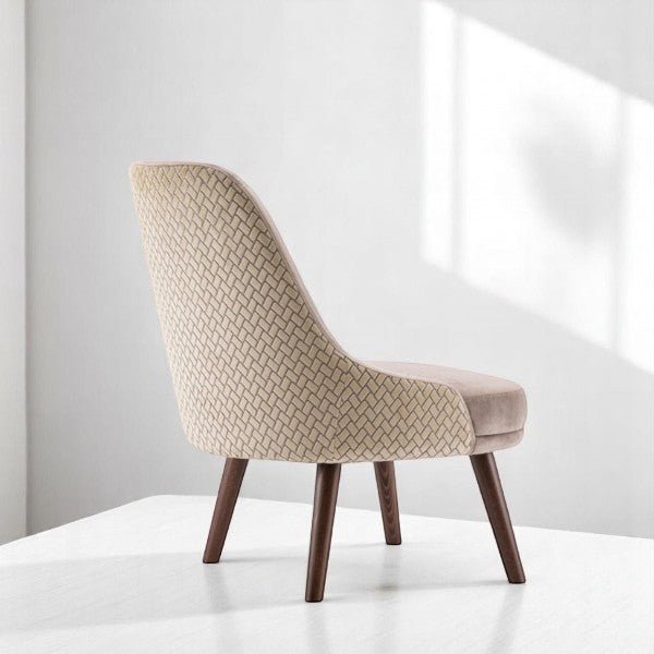 alt="Laid-back grey velvet lounge chair with wide seat and walnut-patterned backrest finish"