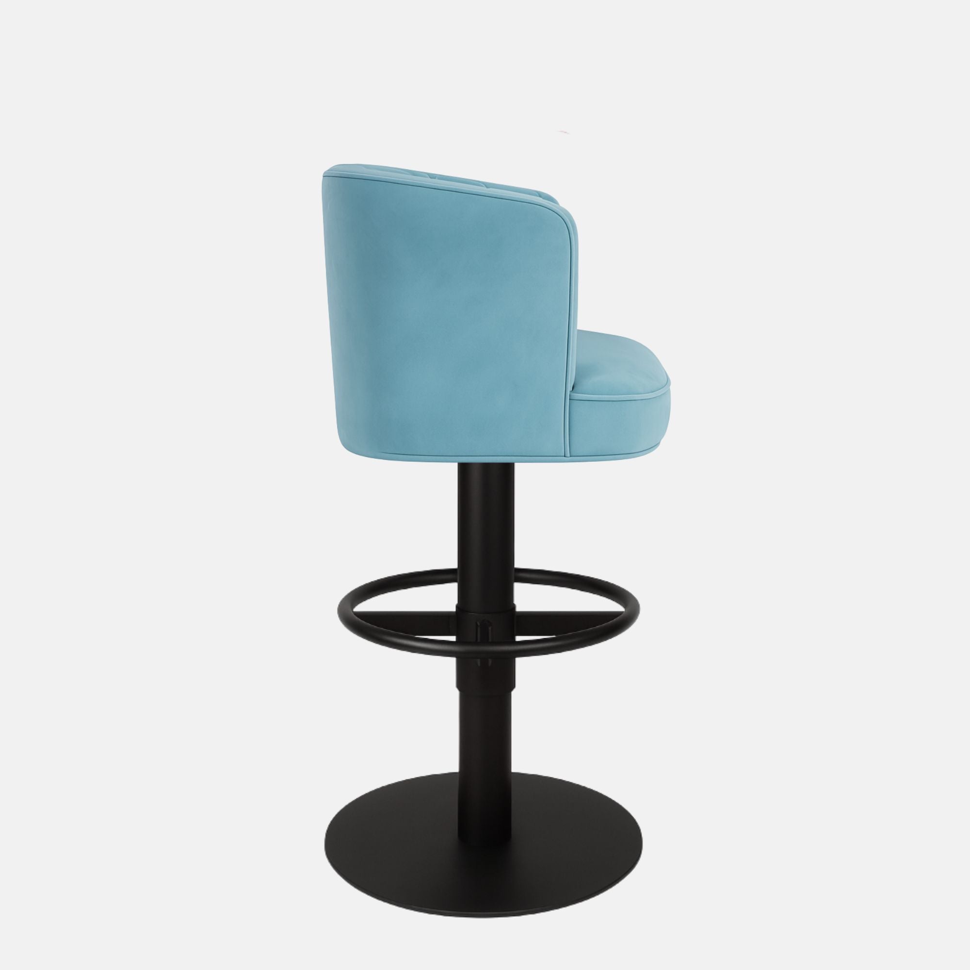 Light blue upholstered bar stool with a quilted backrest, circular black metal footrest, and round black base on a white background.
