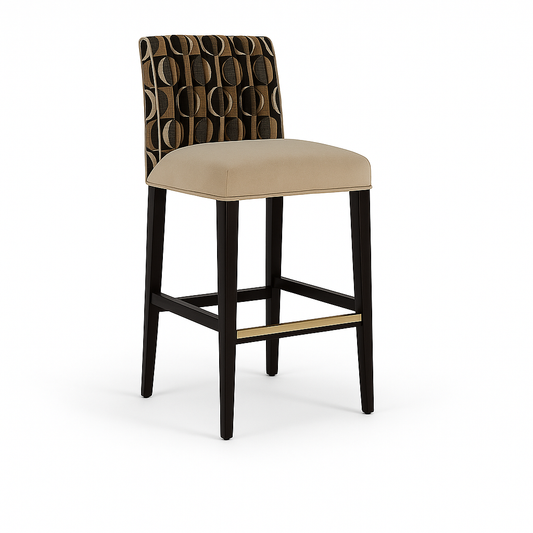 A contemporary barstool with a beige cushioned seat, dark wooden legs, a gold-accent footrest, and a geometric-patterned fabric backrest in black and brown tones.