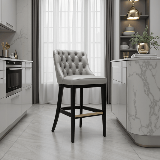 Elegant modern kitchen with marble accents featuring a tufted Gary bar stool with dark wooden legs centred on a light tile floor.