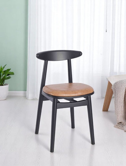 "Italian-style side chair with black frame and brown leather seat pad"