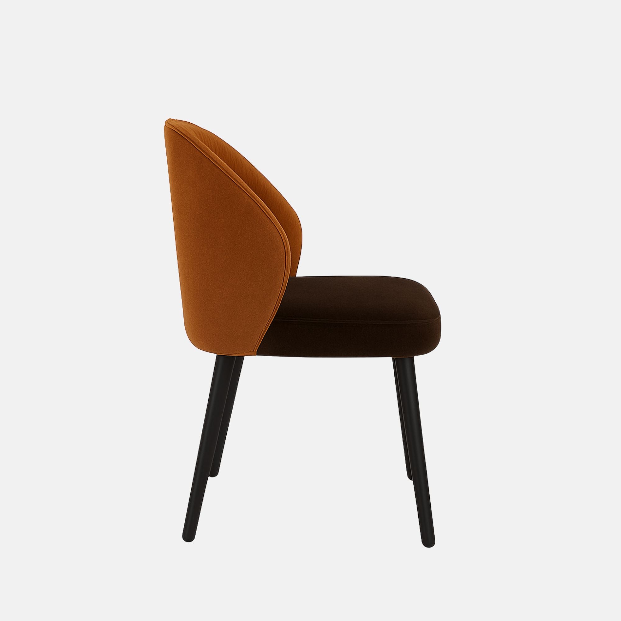 Modern upholstered dining chair with a curved backrest in burnt orange fabric and dark cushioned seat, supported by slim black wooden legs