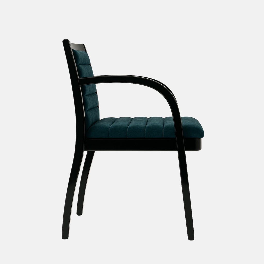 Contemporary armchair with a black wooden frame and curved armrests, upholstered in deep teal velvet with horizontal channel stitching on the seat and backrest, set against a light grey background