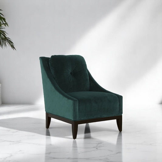 alt="Velvety green armchair with clean lines, soft square seat cushion, and black wooden legs"