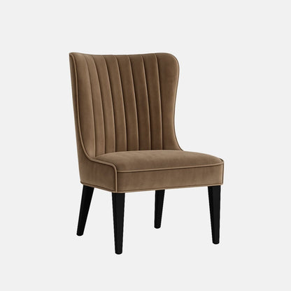 A modern taupe velvet chair with vertical fluted backrest, piped edges, and black wooden legs, shown from the front angle.