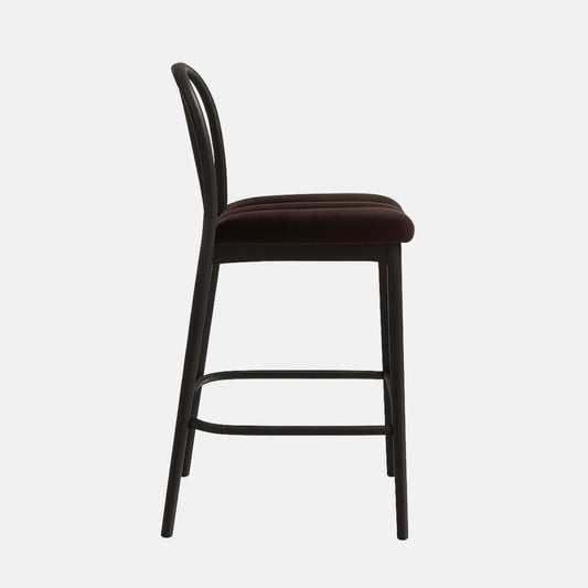 Modern bar stool with black slatted backrest, brown cushioned seat with stitched detail, and slim black wooden legs with metal footrest bar.