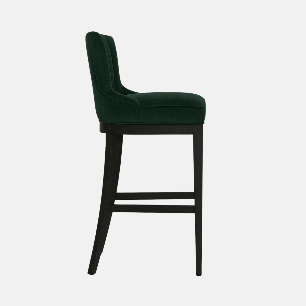Luxury bar stool with deep green upholstered channel-tufted backrest, plush cushioned seat, black wooden frame, and gold footrest accent.