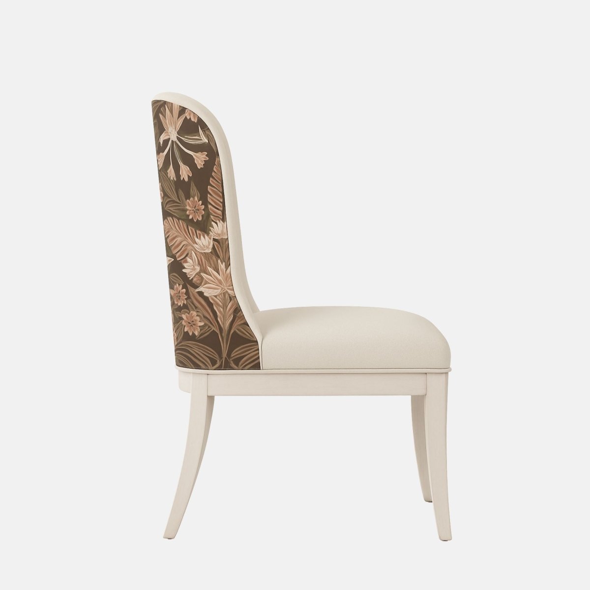 Upholstered dining chair in soft cream fabric with a gently curved backrest and cushioned seat, featuring a floral-patterned fabric panel on the outer back and light wooden legs, shown on a white background.