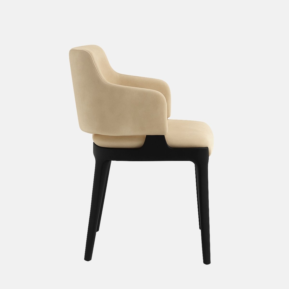 A modern upholstered dining chair with soft beige velvet fabric, a curved backrest, and integrated armrests, supported by sleek black wooden legs