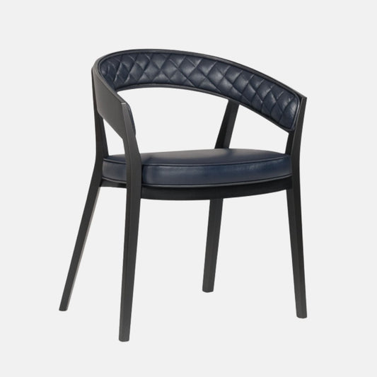 Elegant dining chair with a curved open back, featuring navy blue quilted leather upholstery and a cushioned seat, supported by a sleek black wooden frame and legs, set against a light grey background