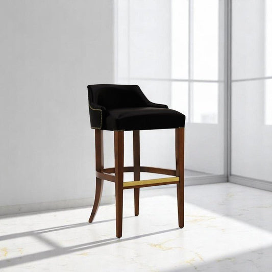 alt="Sleek black bar stool with leather seat and medium oak color legs for a modern look"