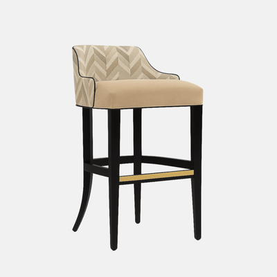 Round beige ottoman with geometric textured upholstery and a gold metallic base.