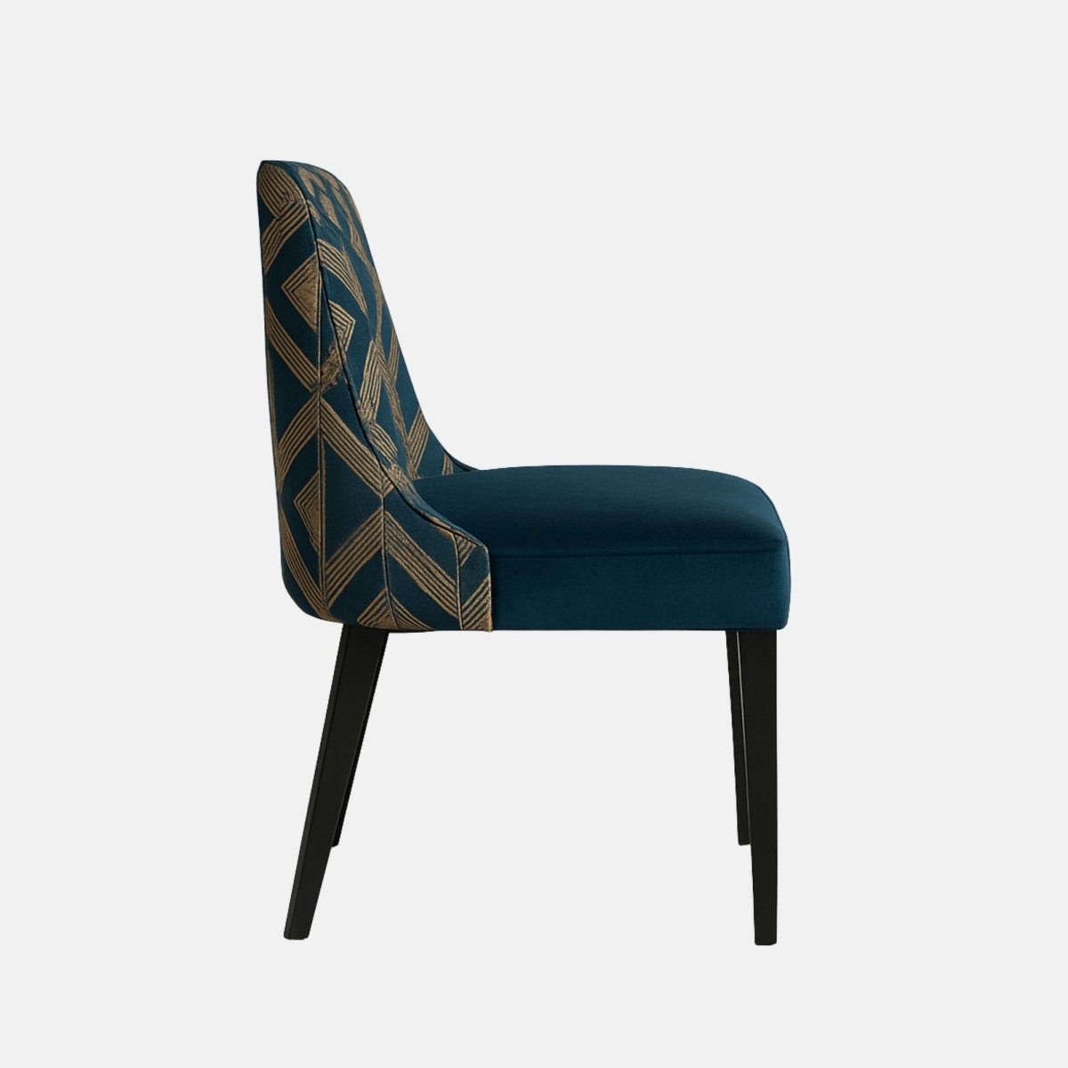 Side view of a modern dining chair with a deep blue velvet seat, gold geometric patterned backrest, and sleek black wooden legs, set against a plain light background.
