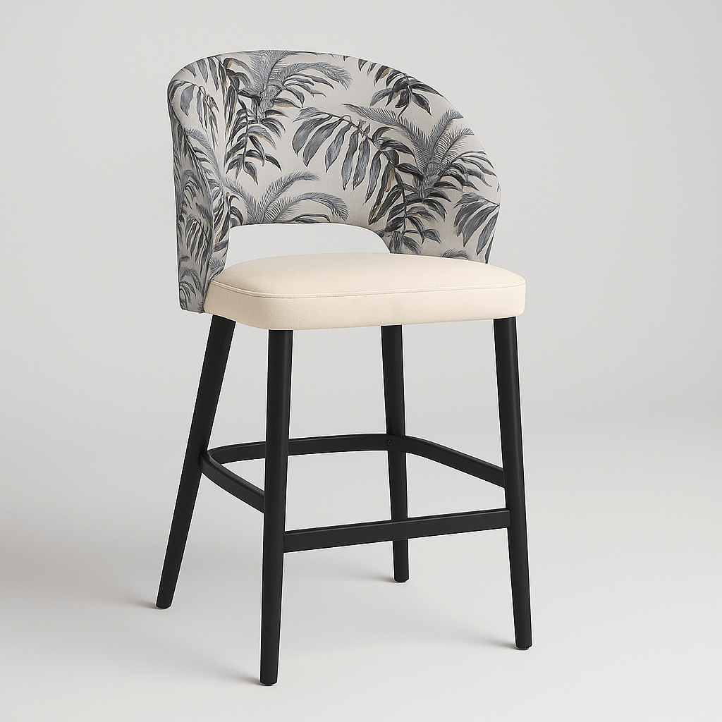 Side view of a contemporary barstool with tropical leaf-patterned upholstery, cream upholstered seat cushion, curved backrest, black wooden legs, and integrated footrest modern furniture design, neutral colour palette, stylish bar seating.