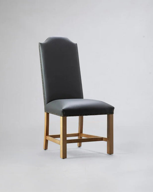 alt="Classic high-back chair in soft grey upholstery with elegant natural oak legs"