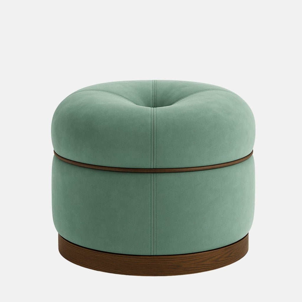Mint green velvet round ottoman with button-tufted top and dark wood base  modern upholstered footstool or accent seat for living room, bedroom, or hotel interior.