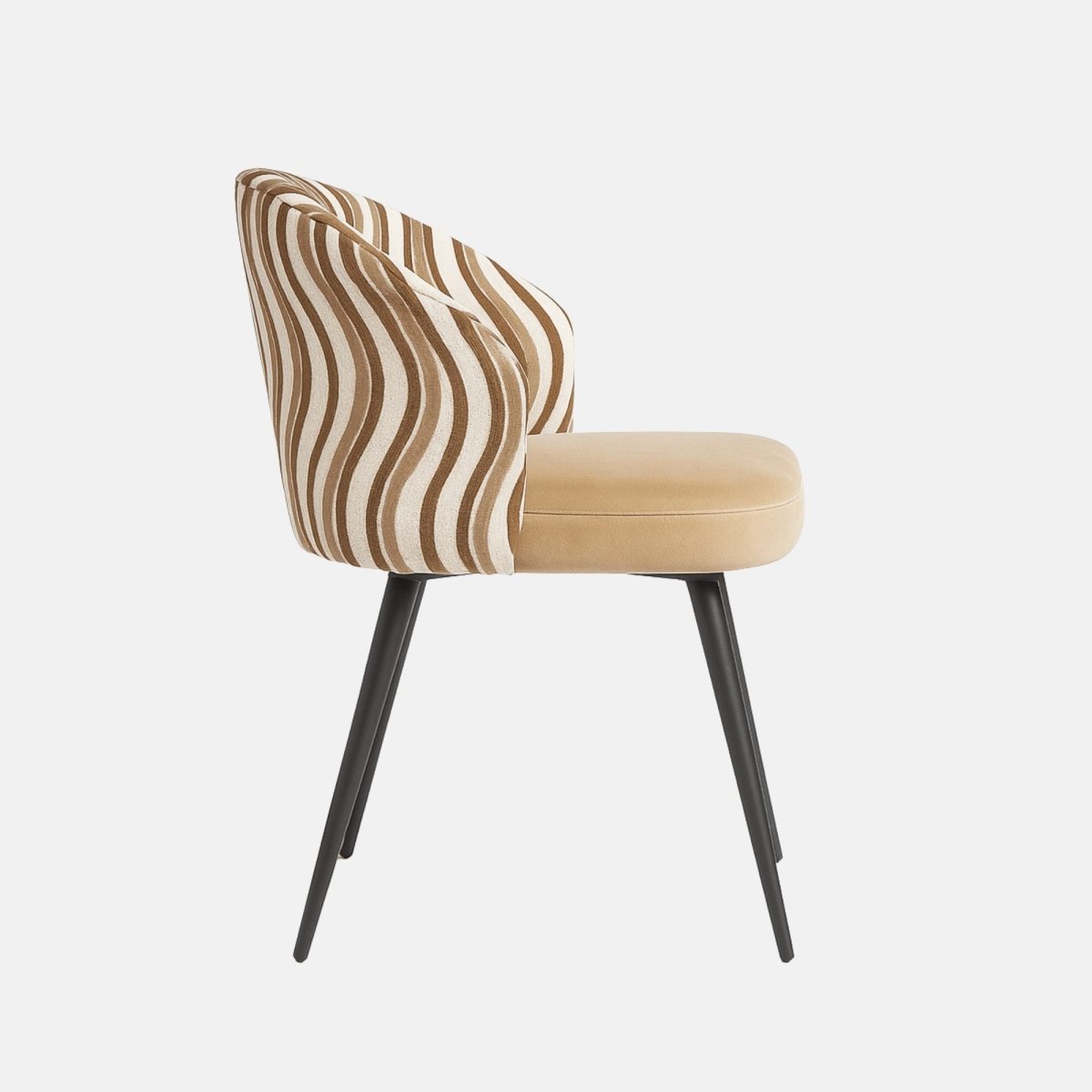 Modern dining chair with curved backrest upholstered in beige and brown wavy patterned fabric, cushioned tan seat, and slim black tapered legs.