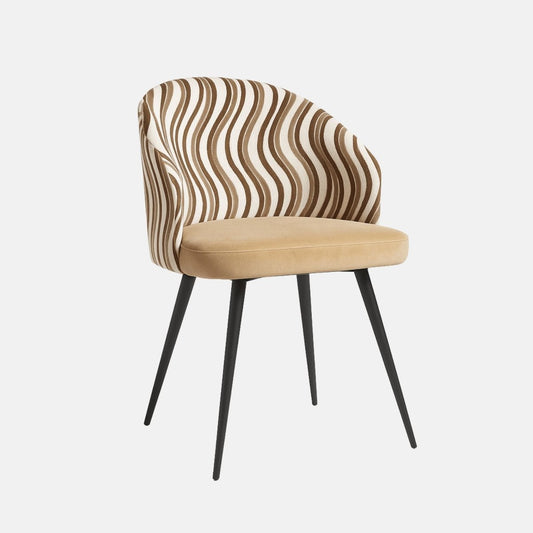 Modern dining chair with curved backrest upholstered in beige and brown wavy patterned fabric, cushioned tan seat, and slim black tapered legs.