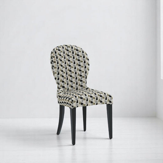 alt="Elegant round full-upholstered back dining chair with patterned fabric and sleek black legs"