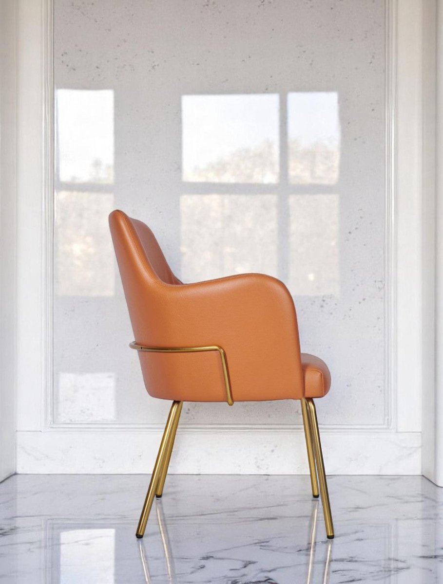 "Orange soft leather armchair with gold metal base"