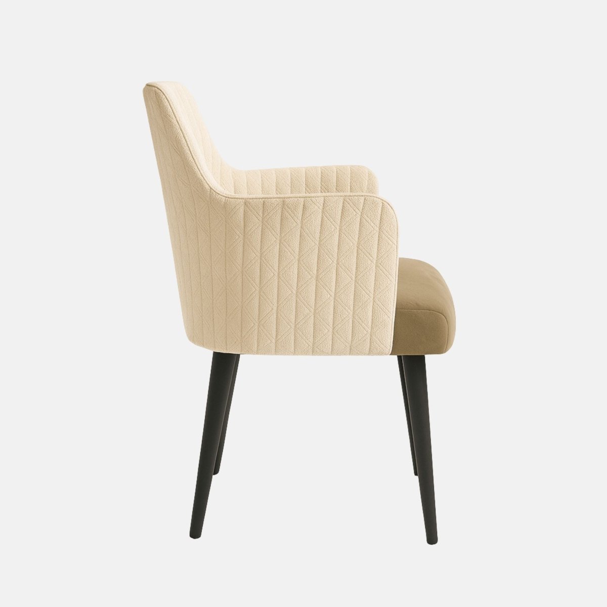 Modern upholstered dining armchair with quilted beige backrest, smooth tan cushioned seat, slim black wooden legs, and integrated armrests