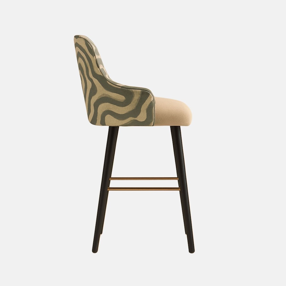Modern bar stool with abstract green patterned upholstered backrest, beige cushioned seat, black tapered wooden legs, and gold footrest support.