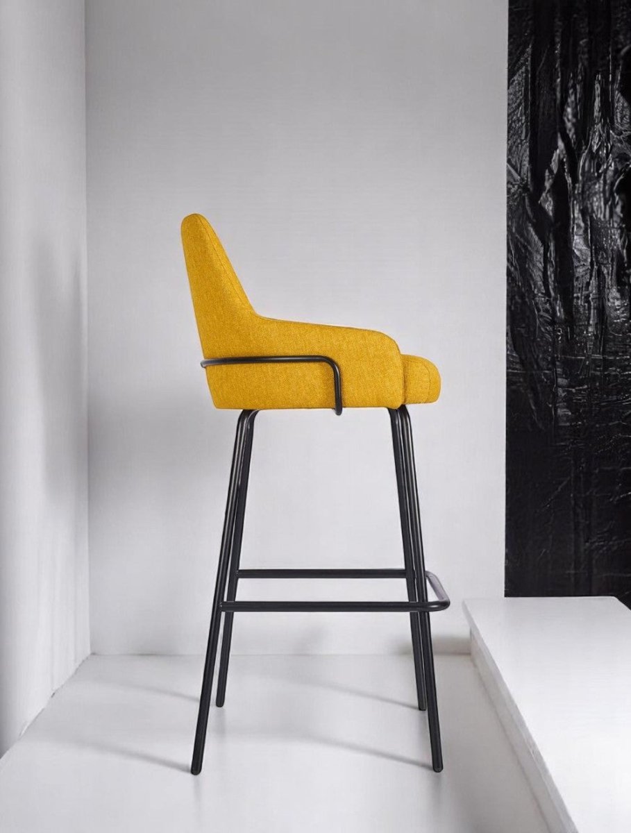 alt="Trendy yellow stool with linen fabric and a stunning black base"