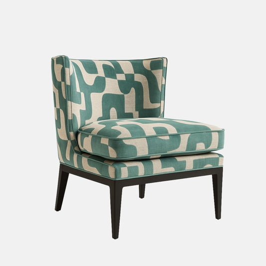 Front view of an armless lounge chair upholstered in teal and cream geometric fabric, with a thick loose seat cushion and black tapered legs on a white background.