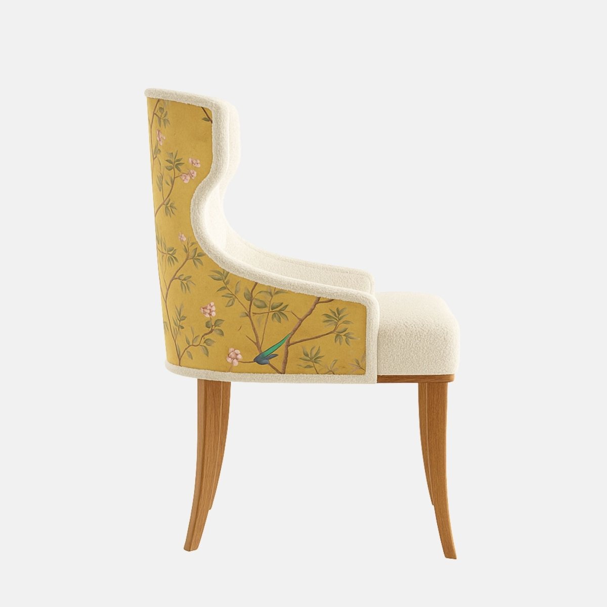 Upholstered dining chair in cream textured fabric with a button-tufted, winged backrest, cushioned seat, subtle patterned fabric on the outer back, and natural wooden legs, shown on a white background