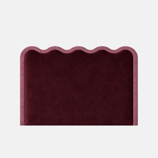 Upholstered headboard in deep red fabric with a scalloped top edge and soft padded finish, shown against a plain background.